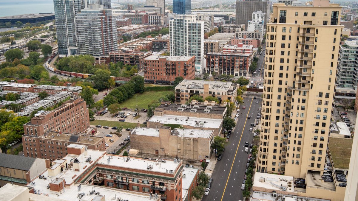 Bird's eye view of downtown Chicago's skyscrapers and streets, showcasing the city's architecture.