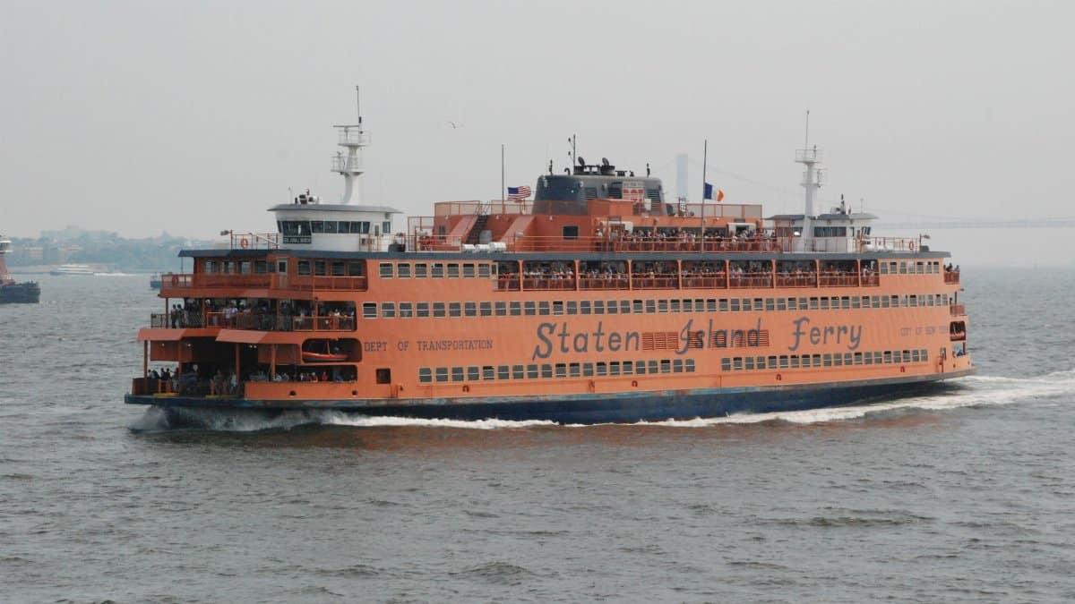 Iconic Staten Island Ferry cruising through New York City's waterways. Ideal for travel enthusiasts.