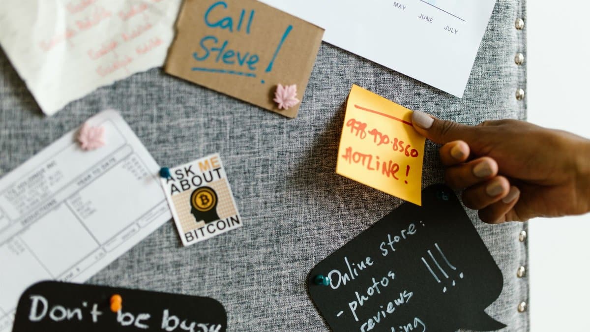 A bulletin board filled with notes, reminders, and motivational quotes, showcasing creativity and organization.