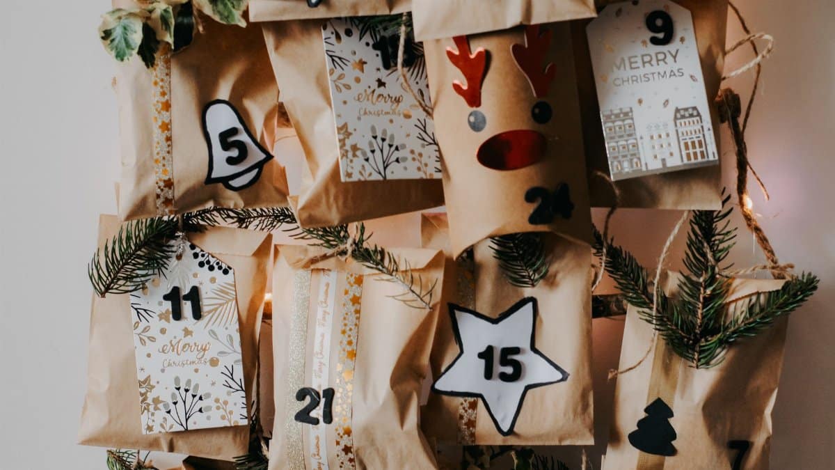 Creative DIY Christmas advent calendar with paper bags and holiday decorations.