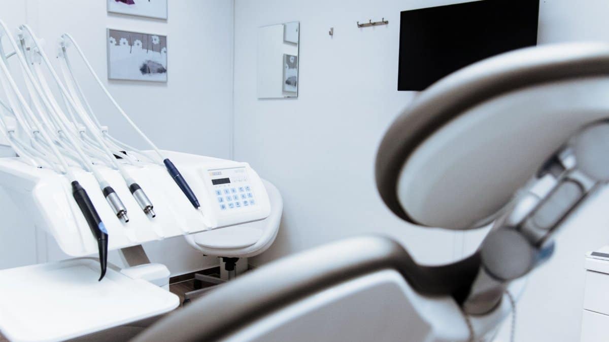 Bright dental office showcasing modern equipment and clean, sleek design.