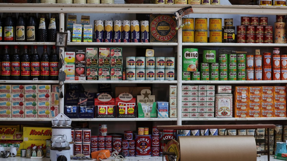 A vintage grocery store shelf filled with retro products and packaging from various brands.