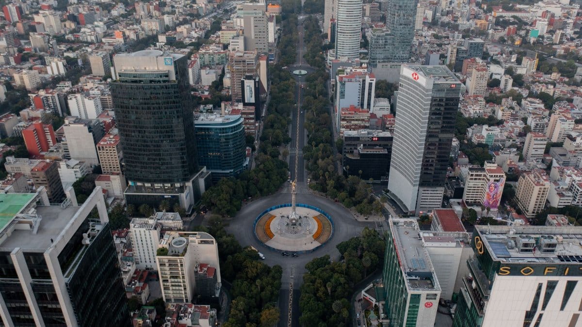 Stunning aerial shot of Mexico City's skyline centered on the Angel of Independence roundabout.