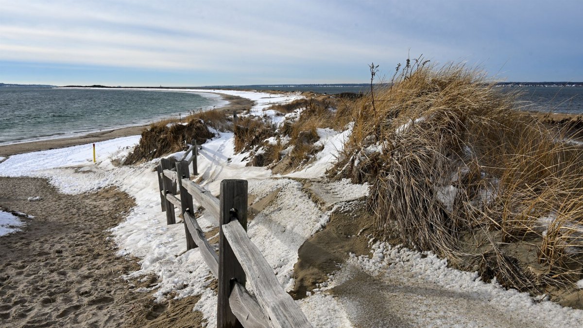 Scenic winter landscape at a snowy beach in Westerly, Rhode Island, with ocean view.