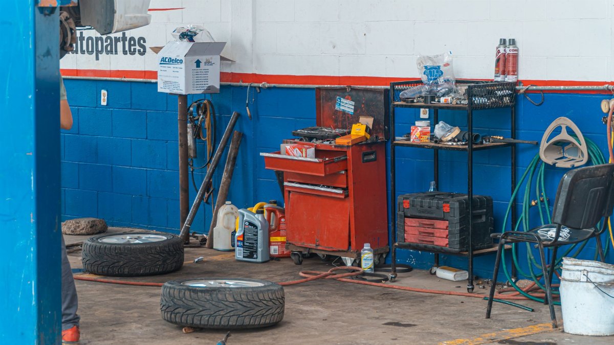 A detailed view of an auto repair garage interior showcasing tools and equipment.
