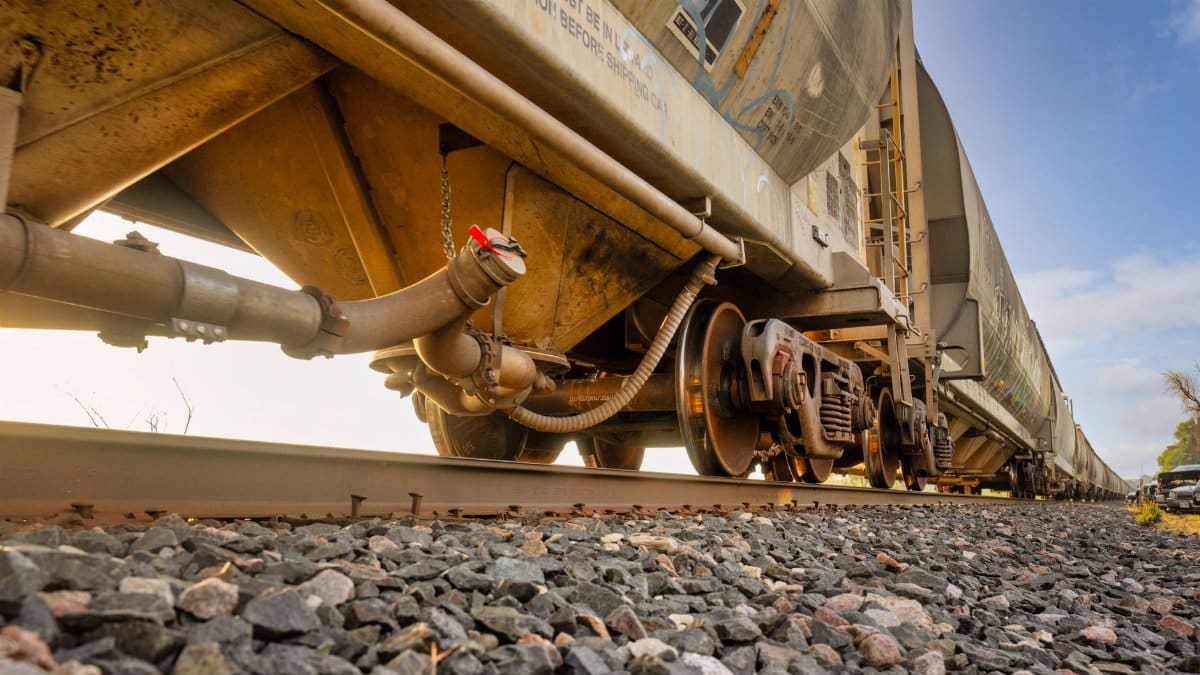 Low-angle view of a freight train on railway tracks in Reads Landing, Minnesota. Industrial transportation scene.