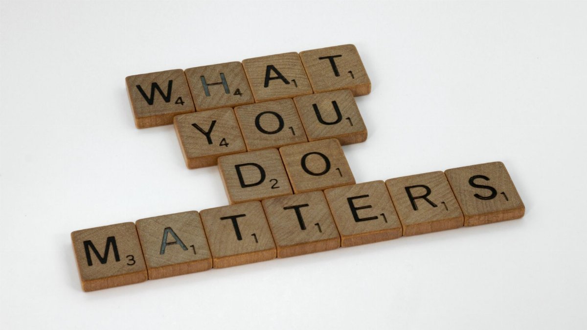 Wooden letter tiles spelling 'What You Do Matters' on a neutral background.