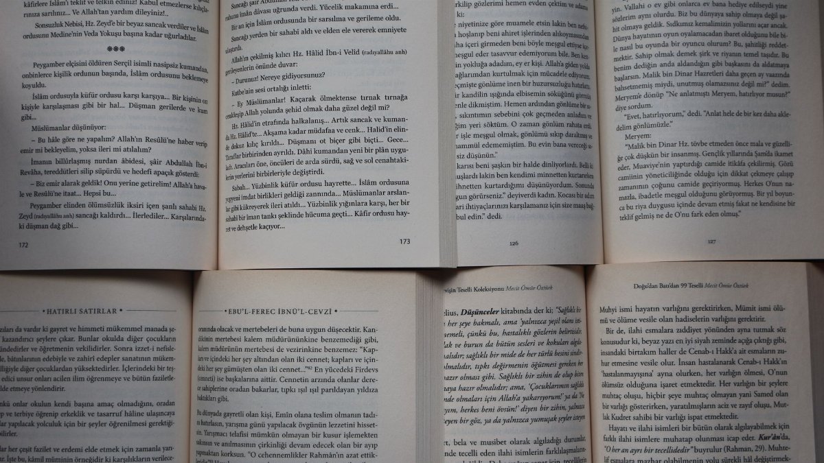 Open books with Turkish text arranged neatly under natural light.