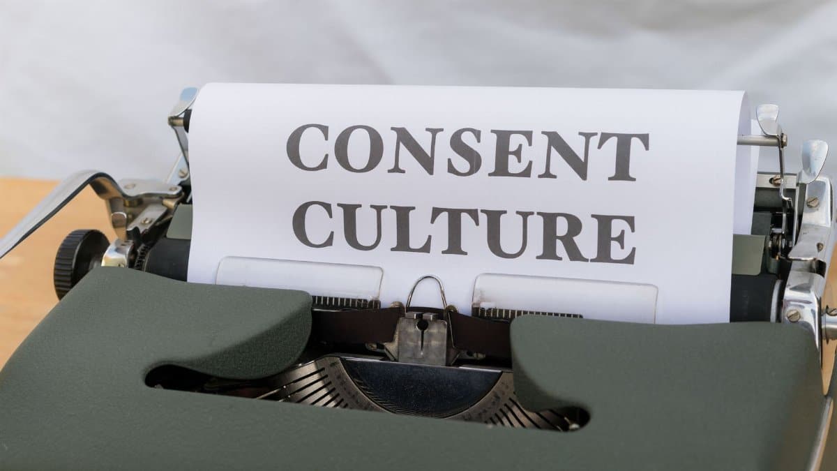 Close-up of the words 'Consent Culture' typed on paper in a vintage typewriter.
