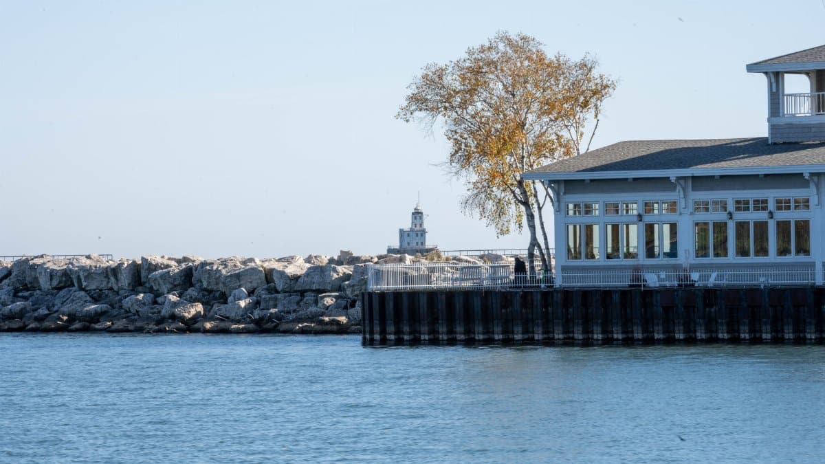 Picturesque scene of Milwaukee waterfront with lighthouse view, perfect for travel inspiration.