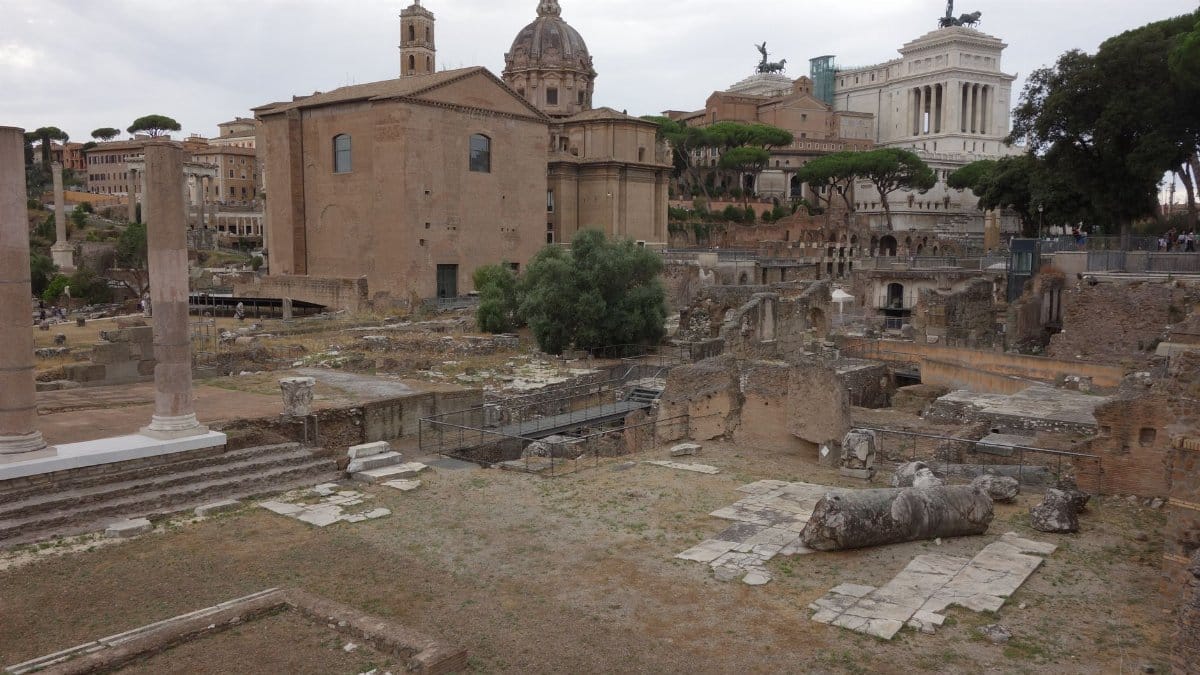 Explore the historic ruins of the Roman Forum in Rome, Italy, featuring ancient architecture and columns.