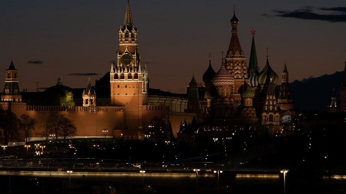 Night view of the illuminated Kremlin and St. Basil's Cathedral in Moscow, Russia.