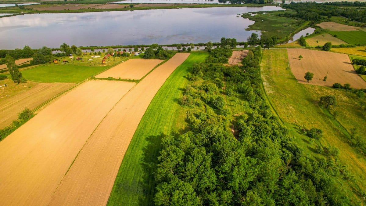 A breathtaking aerial view of Kaniška Iva's landscapes, including lakes and fields.