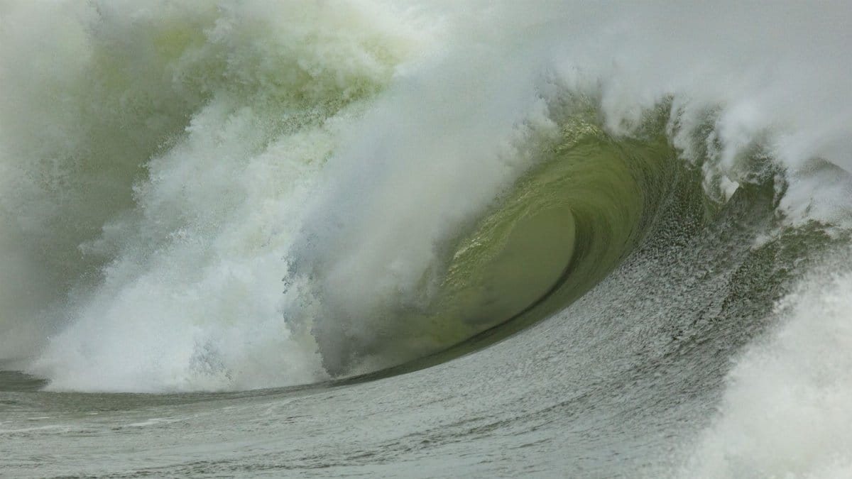 Dynamic image of a powerful ocean wave cresting, capturing the raw energy of nature.