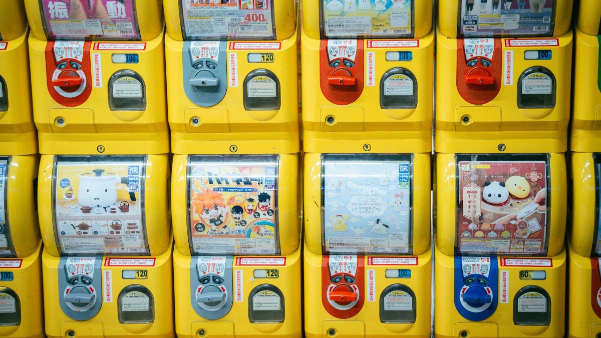 Rows of vibrant gashapon vending machines filled with toys in Taiwan.