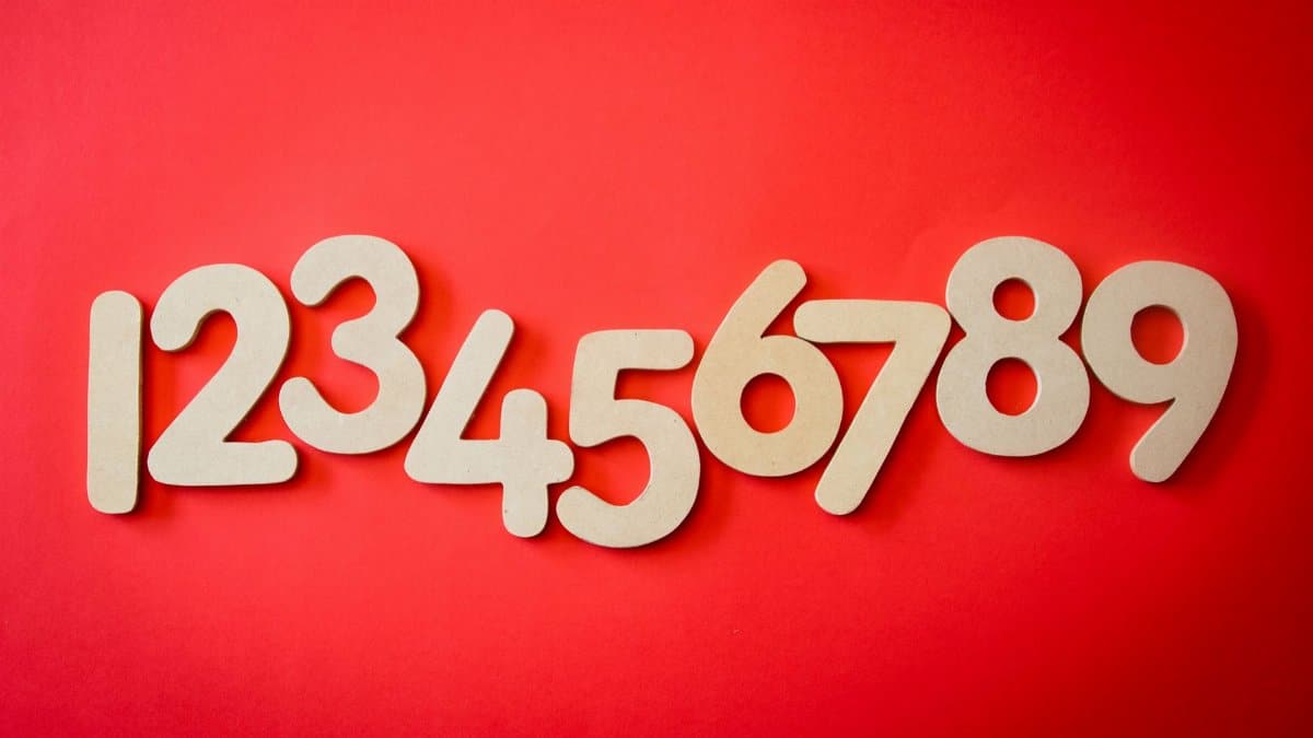 Creative display of numbers one to nine on a vibrant red background, ideal for educational materials.