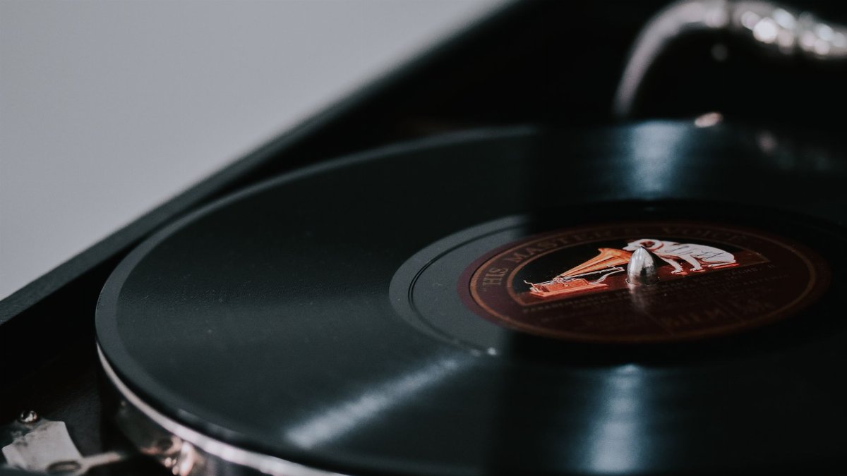A close-up look at a vintage vinyl record spinning on a classic turntable.