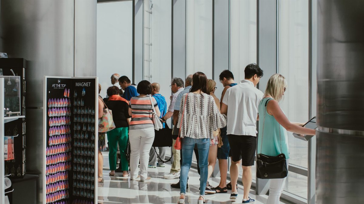 Visitors enjoying the view from the Burj Khalifa observation deck in Dubai.