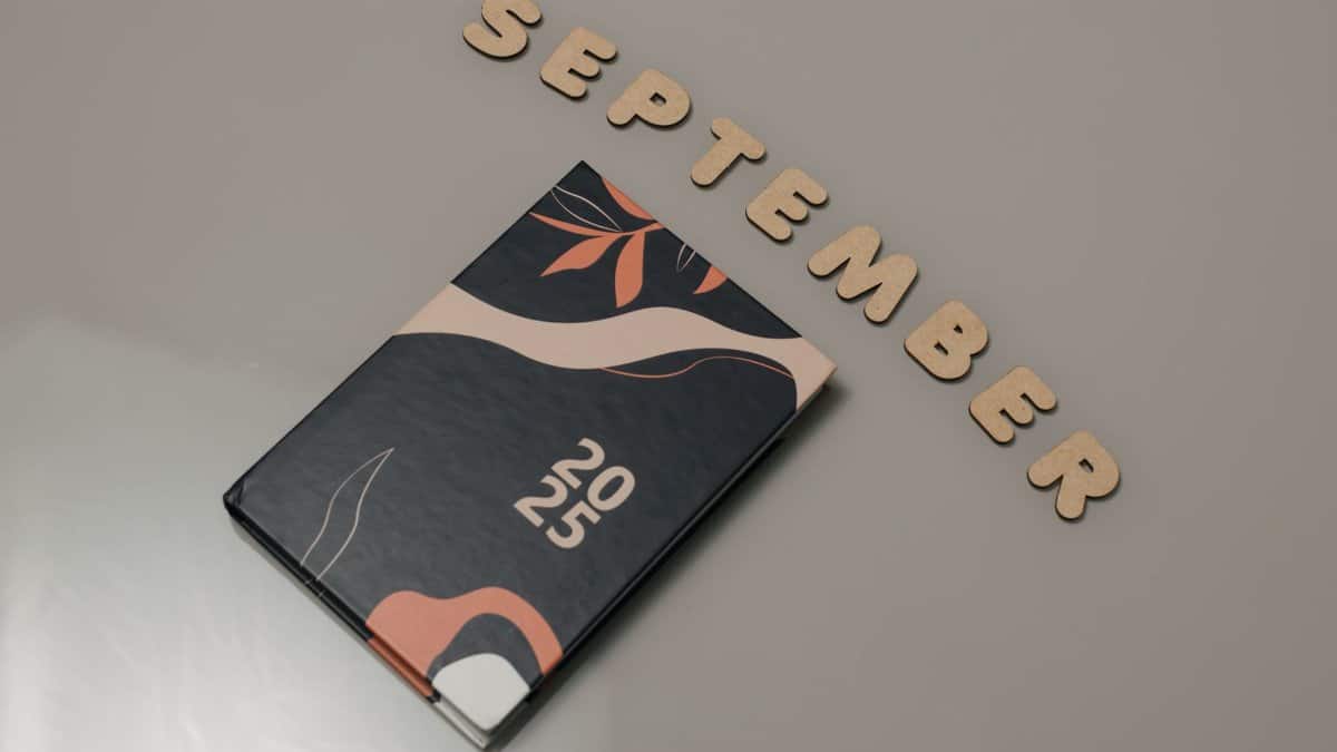 Stylish 2025 planner next to 'September' text, perfect for organization.