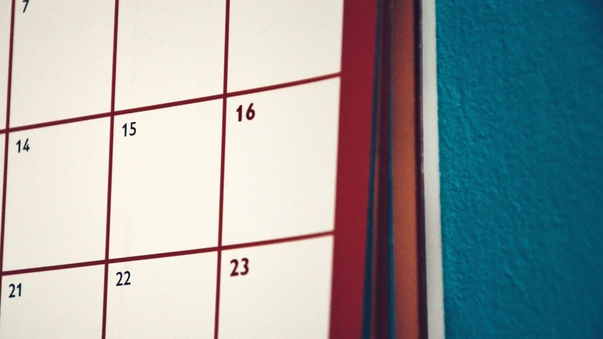 A minimalist calendar hanging on a colorful wall, perfect for planning and organization.