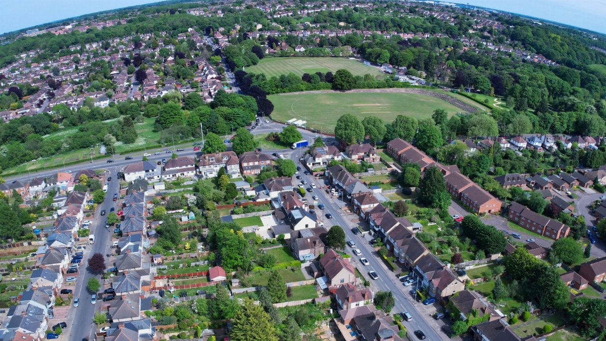 Aerial view of a lush residential neighborhood in Luton, England captured during the day.