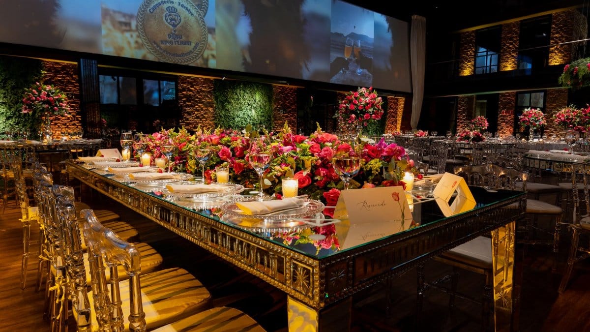 Elegant wedding reception setup with lavish floral centerpieces and chic table arrangements.