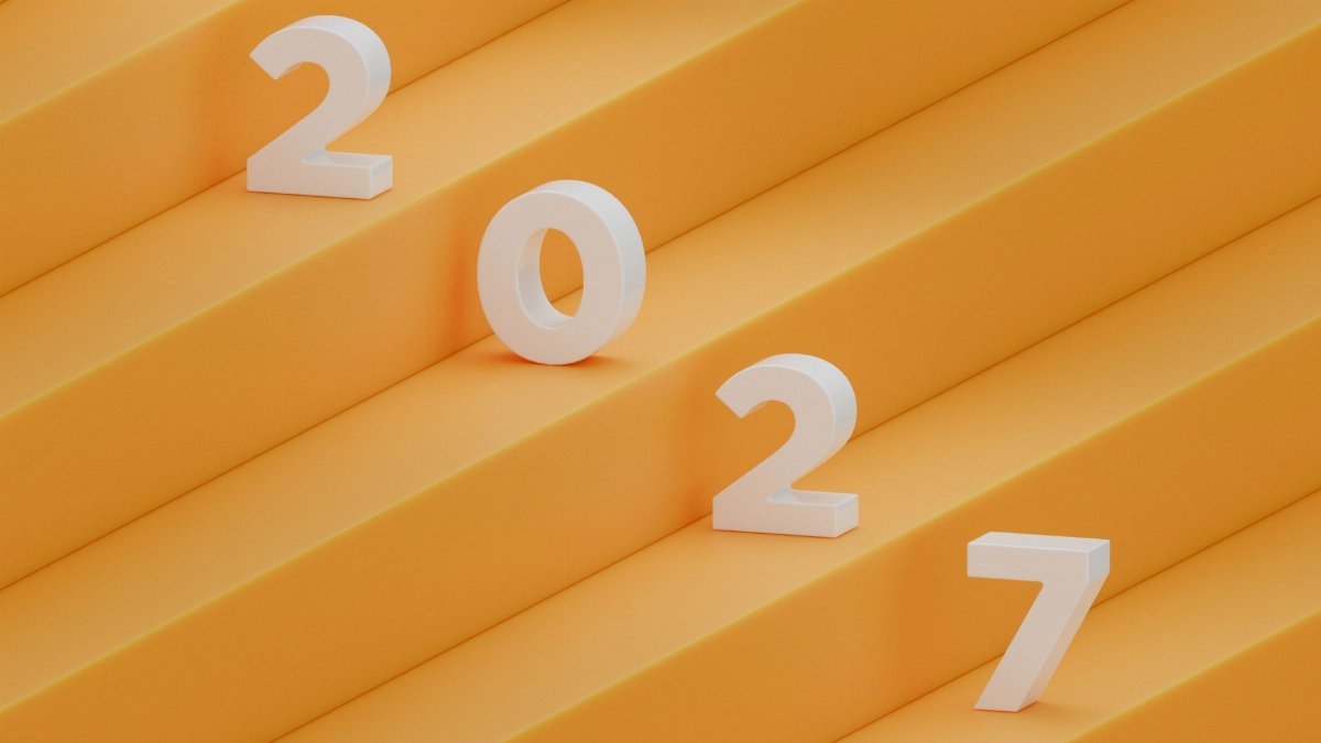 A contemporary 3D render of the year 2027 with bold white numbers on a yellow backdrop.