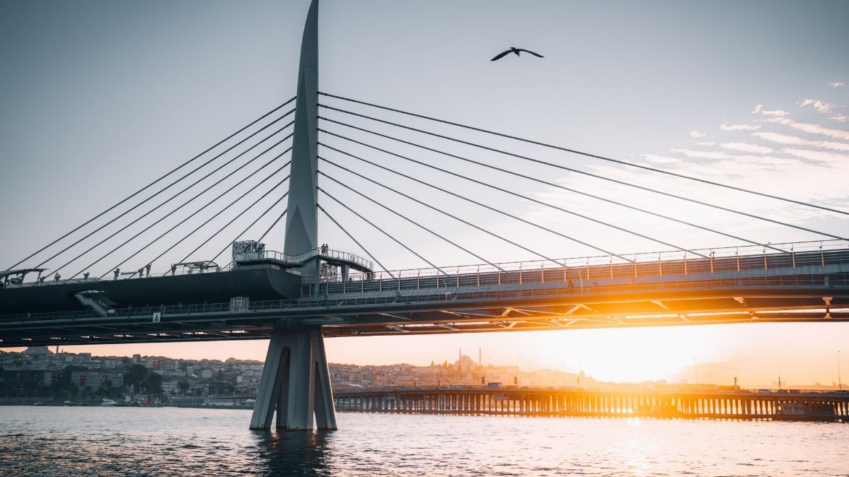 Stunning sunrise view of Istanbul's modern bridge. Perfect for travel and architecture themes.
