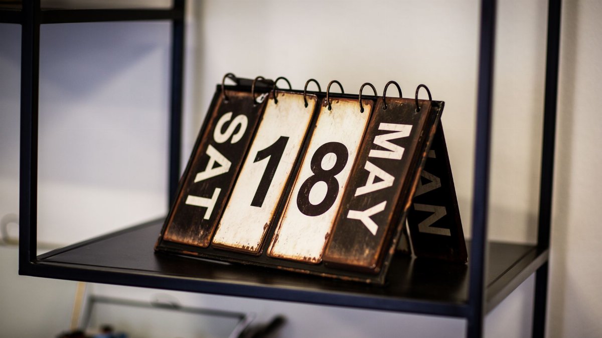 Rustic vintage calendar showing May 18th, perfect for antique decor aesthetics.