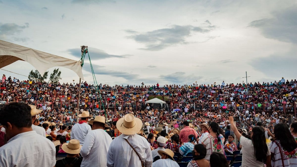 Colorful festival gathering in Oaxaca, showcasing local traditions and vibrant attire.