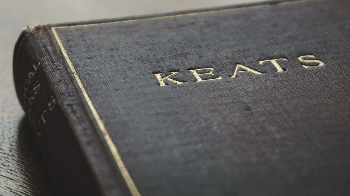 Detailed close-up of a vintage book cover featuring the name Keats embossed in gold.