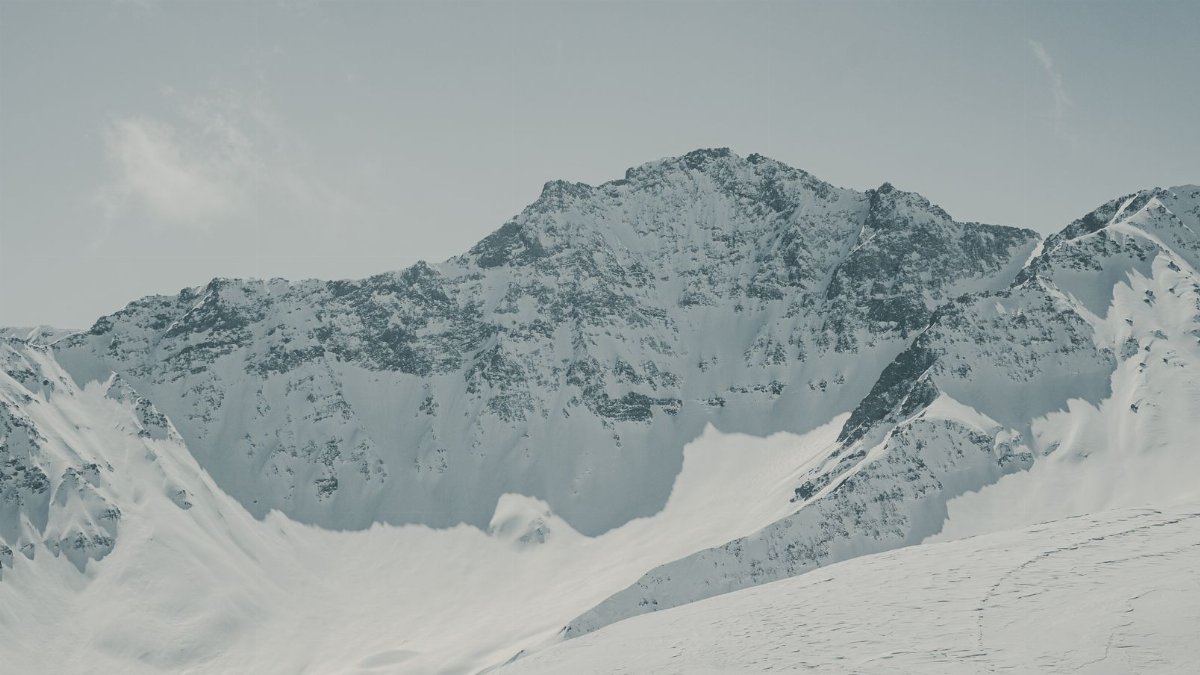 Scenic winter view of snow-covered mountains in Graubünden, Switzerland.