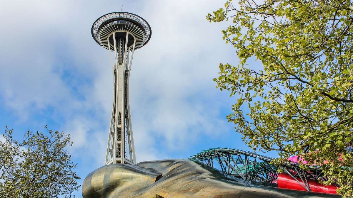 A view of the Space Needle and Museum of Pop Culture in Seattle with a clear blue sky.